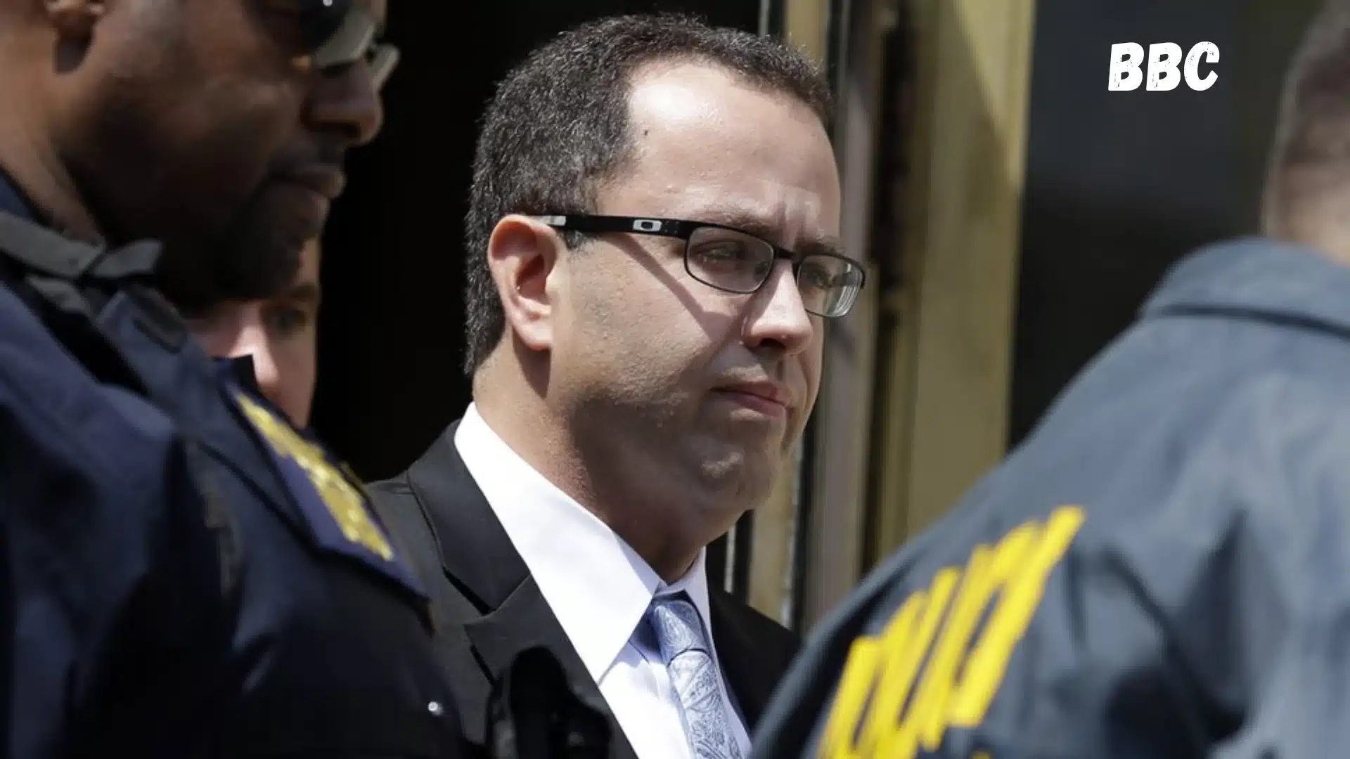 Jared Fogle near Subway restaurant during media coverage of his criminal case and prison sentence