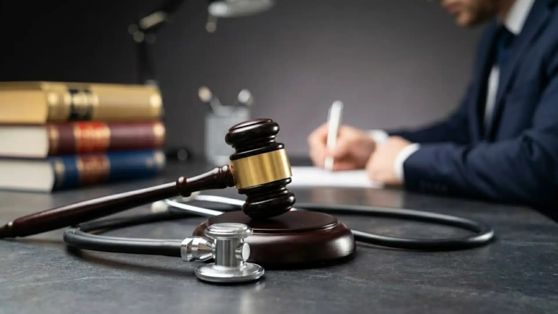 Gavel and stethoscope on legal desk showing medical malpractice and healthcare negligence claims
