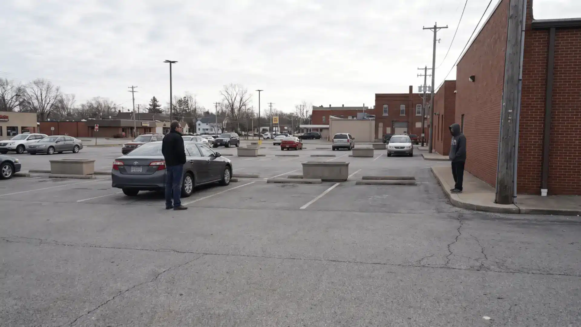 Two people facing each other in a public area showing a situation where danger is being assessed